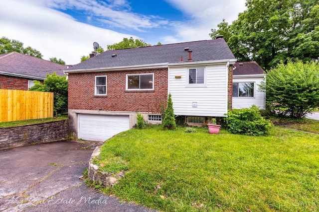 1502 Shenandoah, Cincinnati, OH 45237 - rear view of house with an attached garage, driveway, and a chimney