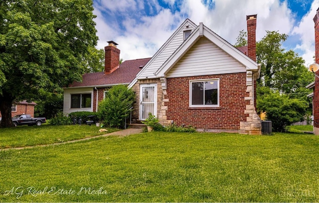 1502 Shenandoah, Cincinnati, OH 45237 - view of front facade featuring a chimney, a front yard, and brick siding