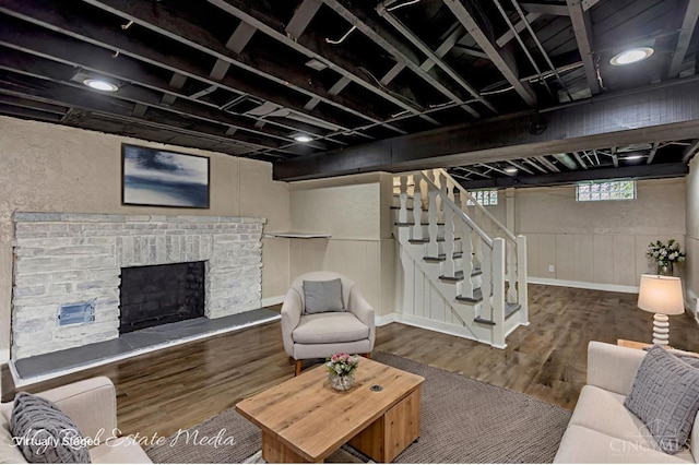 1502 Shenandoah, Cincinnati, OH 45237 - living area featuring wood finished floors, stairway, and a brick fireplace