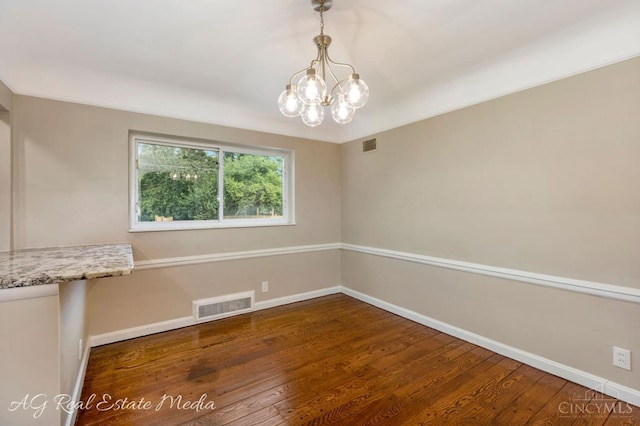 1502 Shenandoah, Cincinnati, OH 45237 - empty room featuring wood finished floors and a chandelier