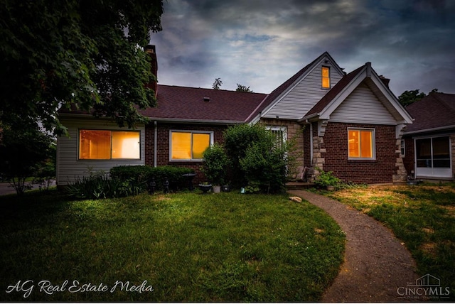 1502 Shenandoah, Cincinnati, OH 45237 - view of front facade with brick siding, a yard, and a chimney