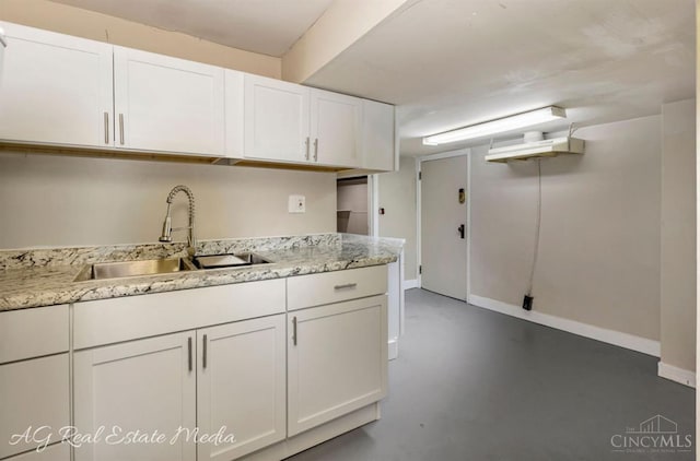 1502 Shenandoah, Cincinnati, OH 45237 - kitchen with concrete flooring, white cabinetry, and light stone countertops
