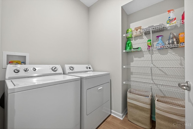 1285 Millstream Dr, Batavia Twp, OH 45102 - laundry area with separate washer and dryer and light wood-type flooring