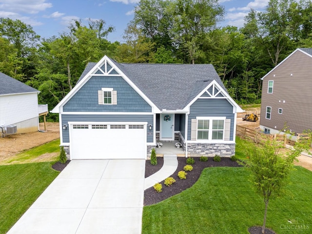 1285 Millstream Dr, Batavia Twp, OH 45102 - view of front of property with stone siding, concrete driveway, a garage, and roof with shingles