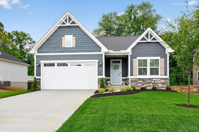 1285 Millstream Dr, Batavia Twp, OH 45102 - craftsman-style home featuring stone siding, a front yard, and concrete driveway