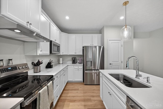 1285 Millstream Dr, Batavia Twp, OH 45102 - kitchen with stainless steel appliances, white cabinets, light wood-style flooring, light countertops, and recessed lighting