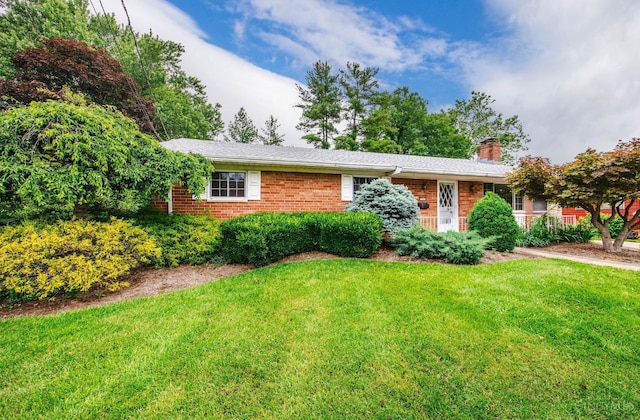 5505 Goldcrest Dr, Green Twp, OH 45238 - ranch-style home with a front yard, brick siding, and a chimney