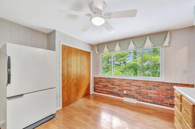5505 Goldcrest Dr, Green Twp, OH 45238 - unfurnished bedroom with freestanding refrigerator, a closet, light wood-style floors, wallpapered walls, and a ceiling fan