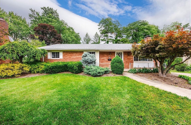 5505 Goldcrest Dr, Green Twp, OH 45238 - ranch-style home featuring a front yard, brick siding, and a chimney