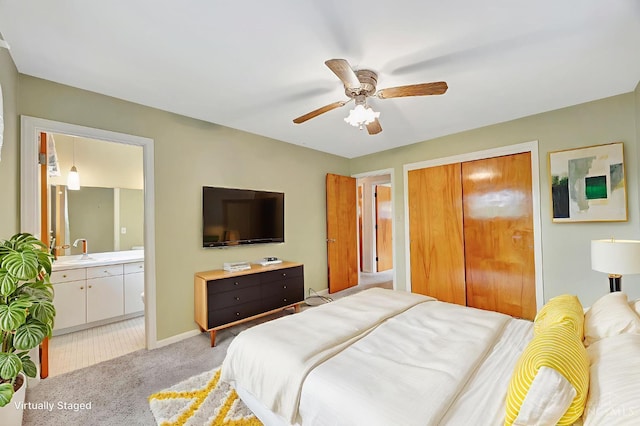 5505 Goldcrest Dr, Green Twp, OH 45238 - bedroom featuring light colored carpet, a closet, ensuite bath, and a ceiling fan