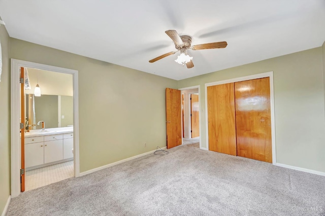 5505 Goldcrest Dr, Green Twp, OH 45238 - unfurnished bedroom featuring light carpet, a closet, connected bathroom, and ceiling fan