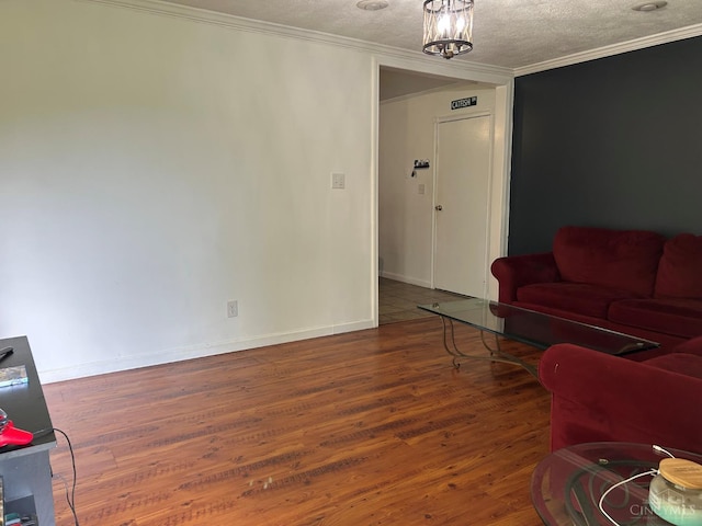 5855 Ivy Hill Rd, Hillsboro, OH 45133 - living room featuring wood finished floors, crown molding, and a textured ceiling