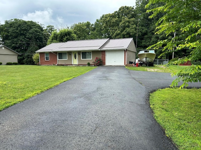 5855 Ivy Hill Rd, Hillsboro, OH 45133 - single story home with an attached garage, a front yard, asphalt driveway, and a metal roof