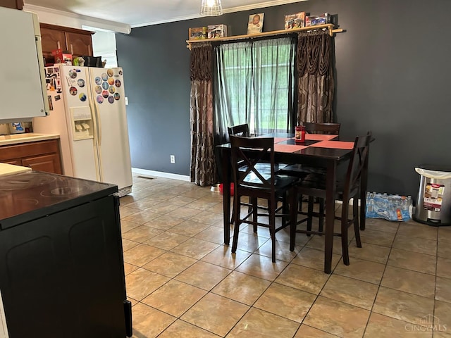 5855 Ivy Hill Rd, Hillsboro, OH 45133 - dining room with light tile patterned floors and ornamental molding