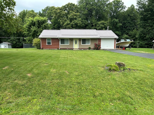 5855 Ivy Hill Rd, Hillsboro, OH 45133 - single story home featuring an attached garage, asphalt driveway, a front yard, brick siding, and a wooded view