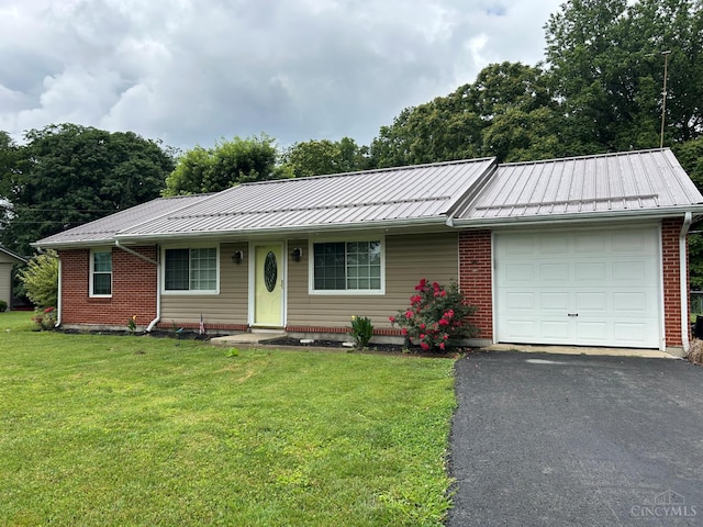 5855 Ivy Hill Rd, Hillsboro, OH 45133 - ranch-style house featuring an attached garage, a front lawn, driveway, and a metal roof
