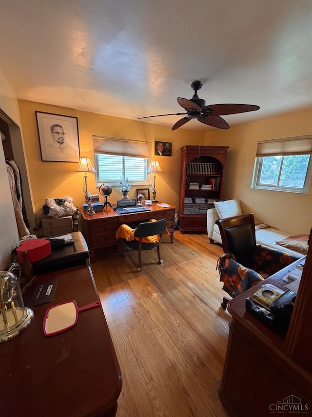 3969 S Fordham Pl, Silverton, OH 45213 - living room featuring light wood-style floors, ceiling fan, and an office area