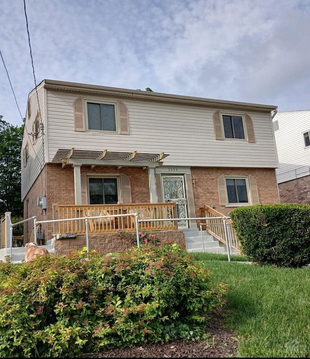 3969 S Fordham Pl, Silverton, OH 45213 - view of front facade with brick siding and a deck