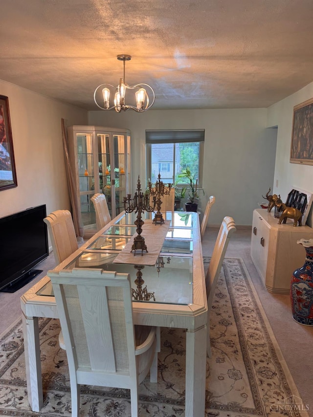 3969 S Fordham Pl, Silverton, OH 45213 - carpeted dining room with a chandelier and a textured ceiling