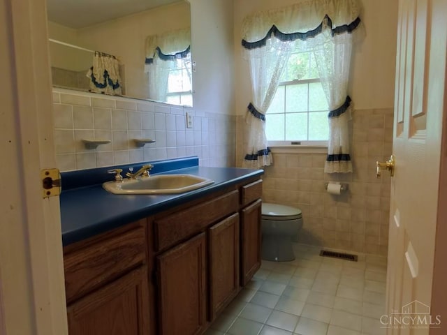 1601 W Concord Rd, Pierce Twp, OH 45102 - full bath featuring tile walls, tile patterned flooring, vanity, curtained shower, and a wainscoted wall