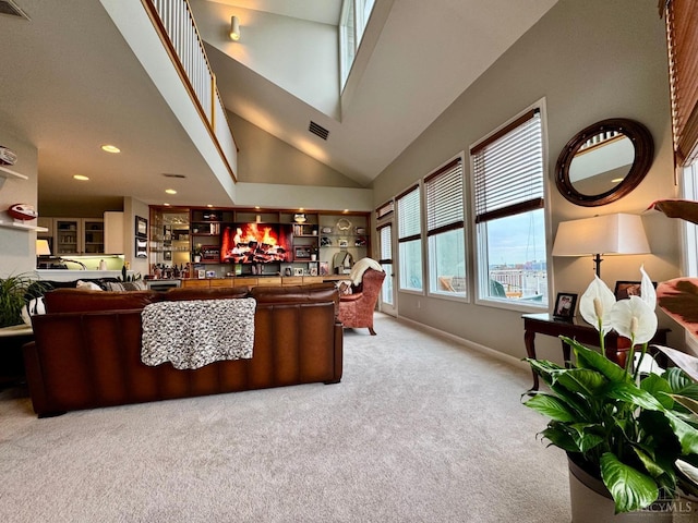 937 Monastery Unit B, Cincinnati, OH 45202 - living room featuring light colored carpet, high vaulted ceiling, recessed lighting, and bar