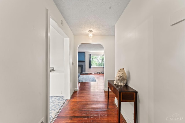 405 Hyde Park Dr, Hamilton, OH 45013 - corridor featuring arched walkways, dark wood-style flooring, and a textured ceiling