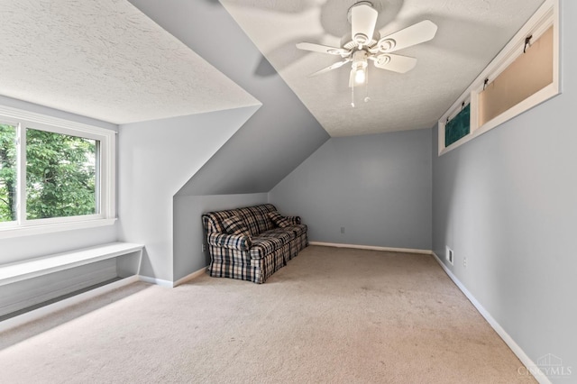 405 Hyde Park Dr, Hamilton, OH 45013 - unfurnished room featuring carpet floors, a textured ceiling, a ceiling fan, and lofted ceiling