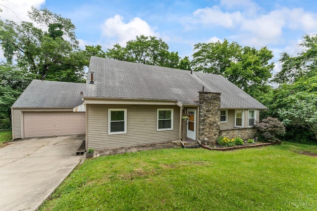 405 Hyde Park Dr, Hamilton, OH 45013 - view of front of house with driveway, a garage, a front yard, stone siding, and a chimney