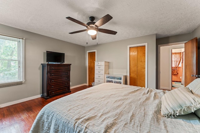 405 Hyde Park Dr, Hamilton, OH 45013 - bedroom with wood finished floors, a ceiling fan, and a textured ceiling