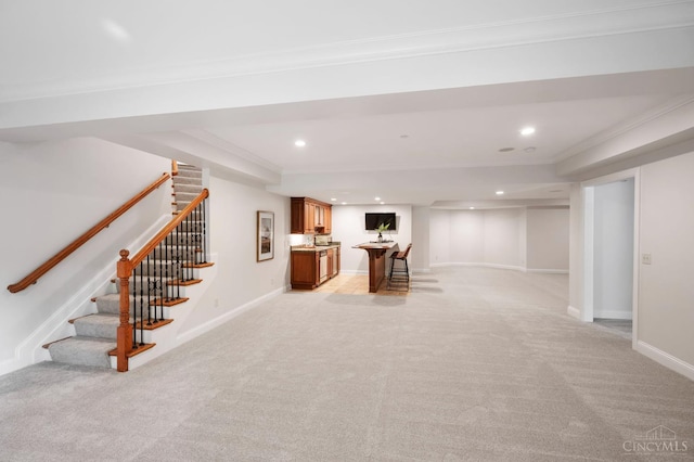 9317 E Kemper Rd, Symmes Twp, OH 45140 - finished basement featuring light carpet, stairs, ornamental molding, recessed lighting, and bar area