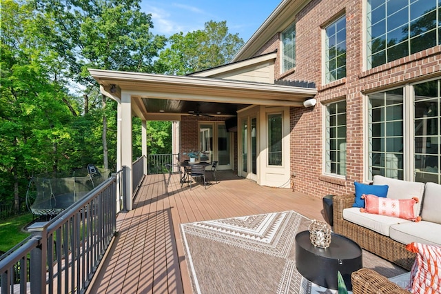 9317 E Kemper Rd, Symmes Twp, OH 45140 - deck featuring ceiling fan, an outdoor hangout area, and outdoor dining area