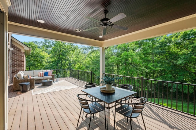 9317 E Kemper Rd, Symmes Twp, OH 45140 - wooden deck with an outdoor hangout area, a ceiling fan, and view of wooded area