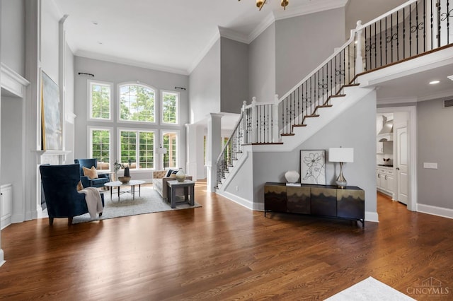 9317 E Kemper Rd, Symmes Twp, OH 45140 - living area featuring a high ceiling, stairway, crown molding, and wood finished floors