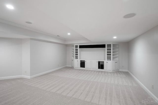 9317 E Kemper Rd, Symmes Twp, OH 45140 - unfurnished living room featuring light colored carpet, recessed lighting, crown molding, a fireplace, and built in shelves