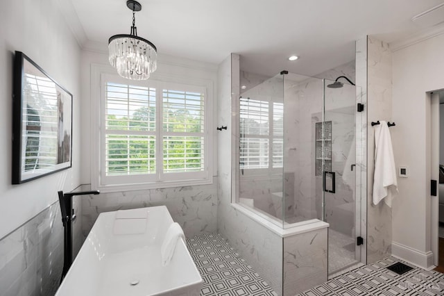 9317 E Kemper Rd, Symmes Twp, OH 45140 - bathroom with tile walls, a freestanding bath, a marble finish shower, a chandelier, and ornamental molding