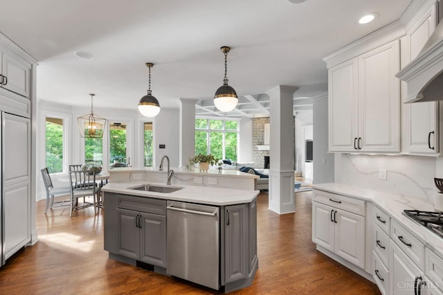 9317 E Kemper Rd, Symmes Twp, OH 45140 - kitchen with stainless steel dishwasher, gray cabinetry, premium range hood, plenty of natural light, and recessed lighting
