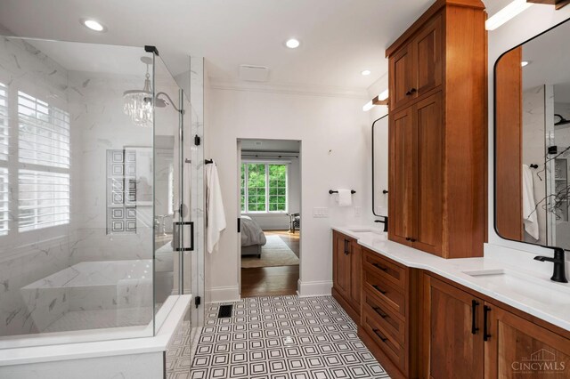 9317 E Kemper Rd, Symmes Twp, OH 45140 - bathroom featuring a marble finish shower, ornamental molding, ensuite bath, double vanity, and a chandelier