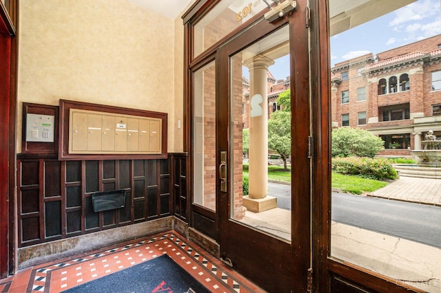 2356 Park Ave Unit 9, Cincinnati, OH 45206 - doorway to outside with carpet flooring, wainscoting, and a high ceiling