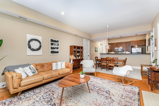 2356 Park Ave Unit 9, Cincinnati, OH 45206 - living area featuring light wood finished floors and recessed lighting