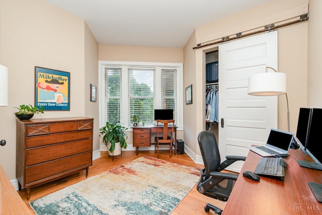 2356 Park Ave Unit 9, Cincinnati, OH 45206 - home office with wood finished floors and a barn door