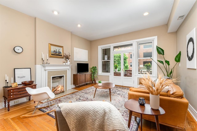 2356 Park Ave Unit 9, Cincinnati, OH 45206 - living area with light wood-style flooring, a tile fireplace, and recessed lighting