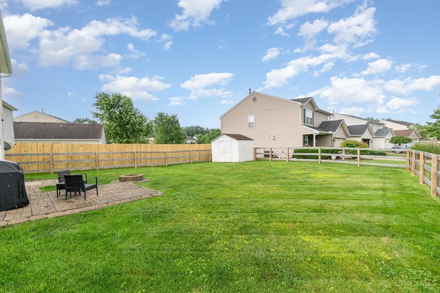 5985 Marsh Cir, Goshen Twp, OH 45140 - fenced backyard with a patio and a storage unit