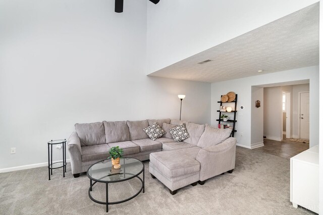 5985 Marsh Cir, Goshen Twp, OH 45140 - living room with light carpet, ceiling fan, and a textured ceiling
