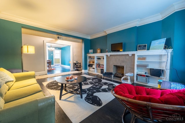 3896 Reading Rd Unit M, Cincinnati, OH 45229 - living area featuring crown molding, wood finished floors, a chandelier, and a fireplace