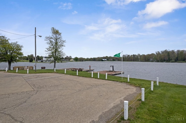 648 Odenwald Dr, Perry Twp, OH 45118 - view of asphalt road with street lighting and a water view