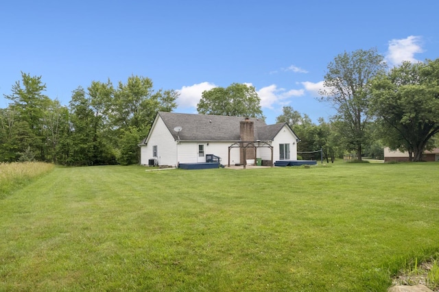 648 Odenwald Dr, Perry Twp, OH 45118 - back of property with a yard and a chimney