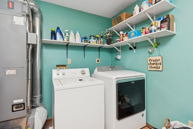 648 Odenwald Dr, Perry Twp, OH 45118 - laundry room with washing machine and clothes dryer and heating unit