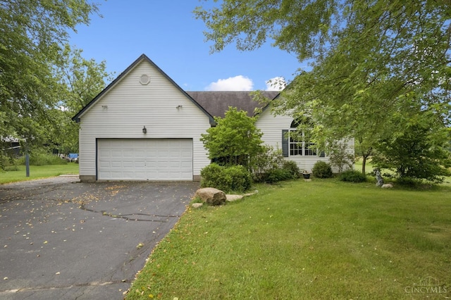 648 Odenwald Dr, Perry Twp, OH 45118 - view of front of property featuring driveway, a front yard, and a garage