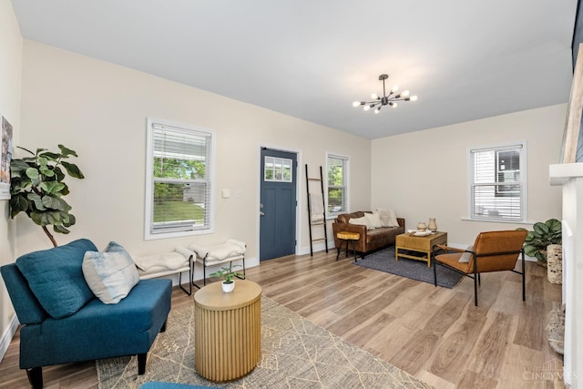 6213 Coleridge Ave, Cincinnati, OH 45213 - living room featuring wood finished floors and a chandelier