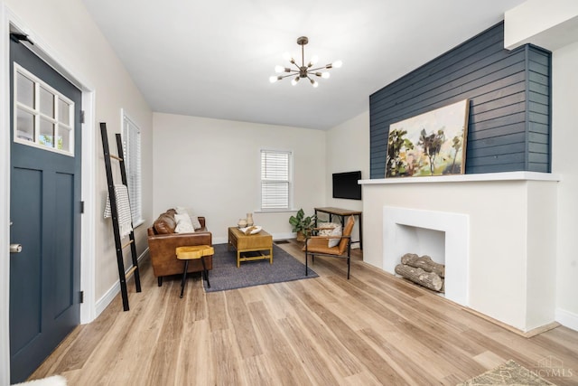 6213 Coleridge Ave, Cincinnati, OH 45213 - living room with wood finished floors and a chandelier